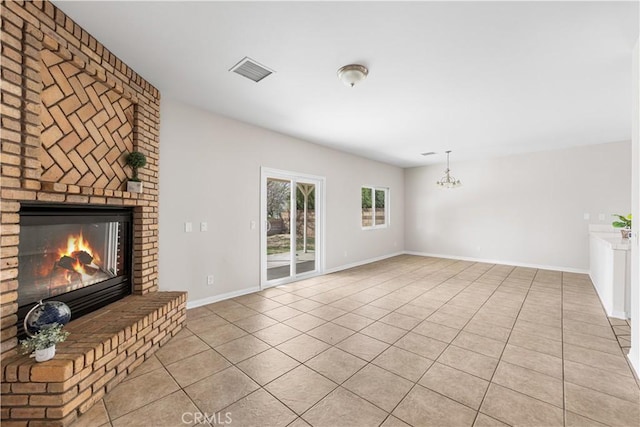 43453 Tali St, Lancaster, CA 93535 - unfurnished living room featuring light tile patterned flooring, a brick fireplace, baseboards, and a chandelier