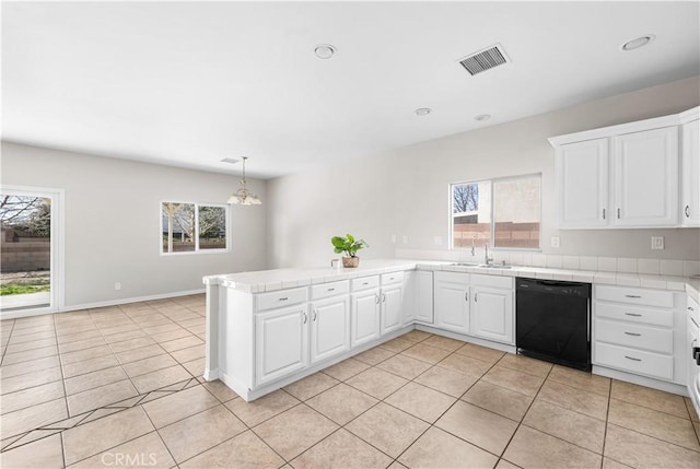 43453 Tali St, Lancaster, CA 93535 - kitchen with black dishwasher, tile counters, a peninsula, plenty of natural light, and recessed lighting
