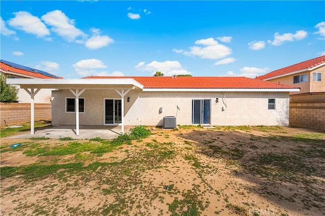 43453 Tali St, Lancaster, CA 93535 - back of property featuring a patio area, stucco siding, a tile roof, and central AC unit