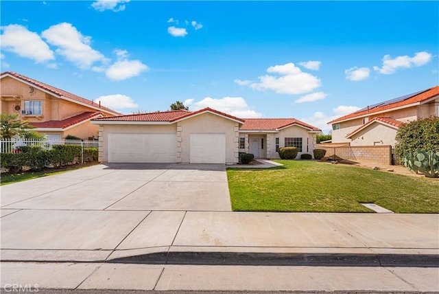43453 Tali St, Lancaster, CA 93535 - view of front facade with a garage, driveway, a tiled roof, and stucco siding