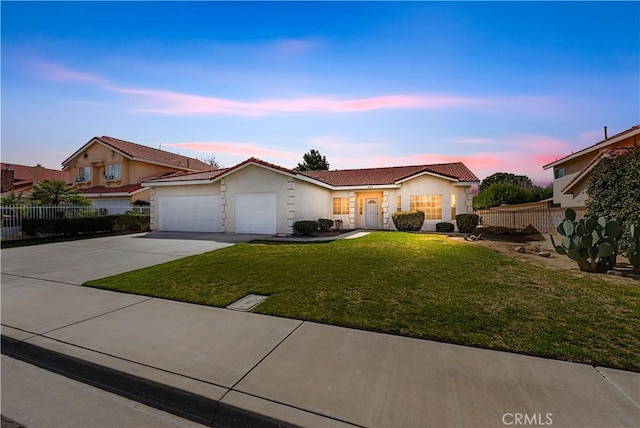 43453 Tali St, Lancaster, CA 93535 - ranch-style home with driveway, an attached garage, and stucco siding
