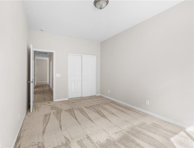 43453 Tali St, Lancaster, CA 93535 - unfurnished bedroom featuring carpet flooring, a closet, and baseboards