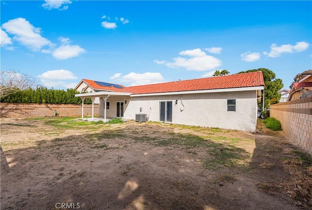 43453 Tali St, Lancaster, CA 93535 - back of property featuring central air condition unit, stucco siding, a fenced backyard, a patio area, and a tiled roof