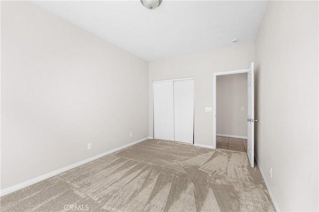 43453 Tali St, Lancaster, CA 93535 - unfurnished bedroom with carpet flooring, a closet, and baseboards
