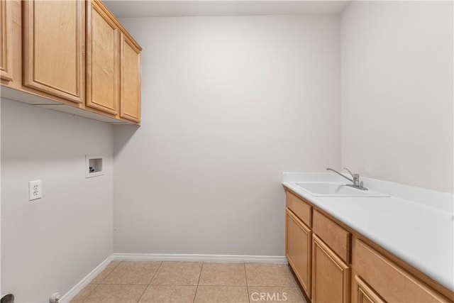 40729 Oakmont Ct, Palmdale, CA 93551 - washroom featuring washer hookup, light tile patterned floors, baseboards, and cabinet space
