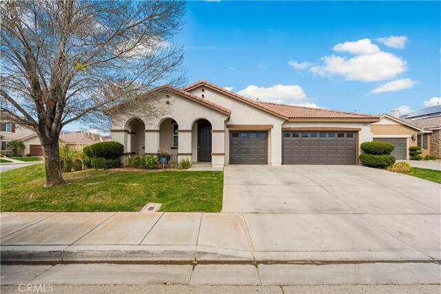 40729 Oakmont Ct, Palmdale, CA 93551 - mediterranean / spanish home featuring stucco siding, an attached garage, a tile roof, and concrete driveway