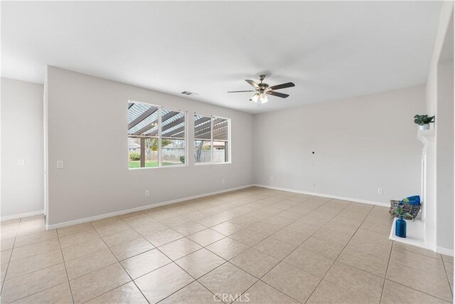 40729 Oakmont Ct, Palmdale, CA 93551 - unfurnished room with ceiling fan, light tile patterned floors, and baseboards