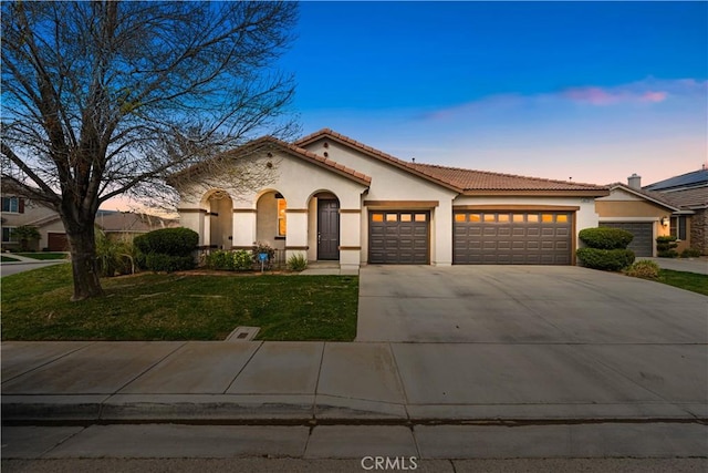40729 Oakmont Ct, Palmdale, CA 93551 - mediterranean / spanish house featuring stucco siding, a garage, concrete driveway, and a tile roof