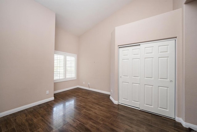 5110 Wisteria Dr, Oceanside, CA 92056 - unfurnished bedroom featuring dark wood-style floors, baseboards, lofted ceiling, and a closet