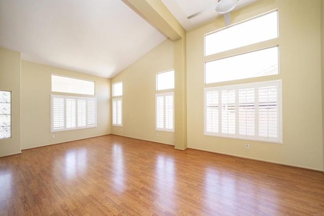 5110 Wisteria Dr, Oceanside, CA 92056 - empty room featuring ceiling fan, high vaulted ceiling, wood finished floors, beam ceiling, and baseboards
