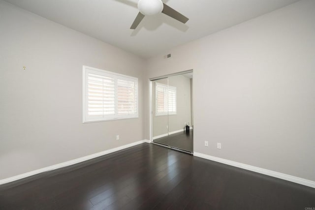 5110 Wisteria Dr, Oceanside, CA 92056 - unfurnished bedroom featuring a closet, baseboards, dark wood-style floors, and ceiling fan