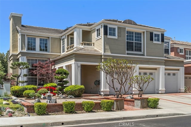 22581 Summerfield, Mission Viejo, CA 92692 - view of front of house featuring an attached garage, concrete driveway, and a chimney