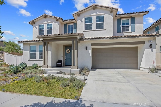 18171 Hedgerow Way, Saugus, CA 91350 - mediterranean / spanish-style home featuring a garage, stucco siding, concrete driveway, and a tiled roof