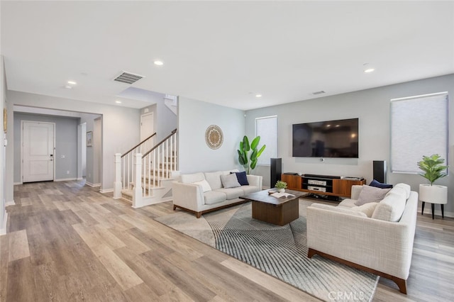 18171 Hedgerow Way, Saugus, CA 91350 - living room featuring stairs, light wood-style flooring, and recessed lighting