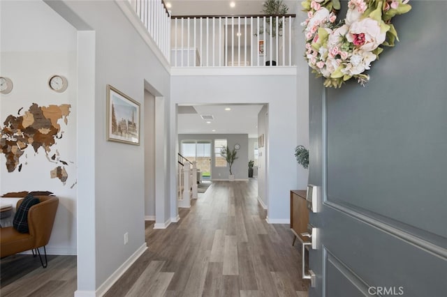 18171 Hedgerow Way, Saugus, CA 91350 - entryway with wood finished floors, a high ceiling, and stairs
