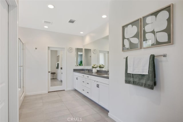 18171 Hedgerow Way, Saugus, CA 91350 - bathroom with double vanity, a shower with door, tile patterned flooring, and recessed lighting