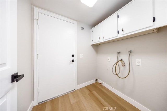 621 Foxhaven Pl, Diamond Bar, CA 91765 - laundry area featuring cabinet space, washer hookup, light wood-style flooring, and baseboards