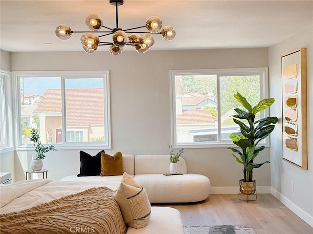 621 Foxhaven Pl, Diamond Bar, CA 91765 - bedroom with multiple windows, light wood finished floors, a chandelier, and baseboards