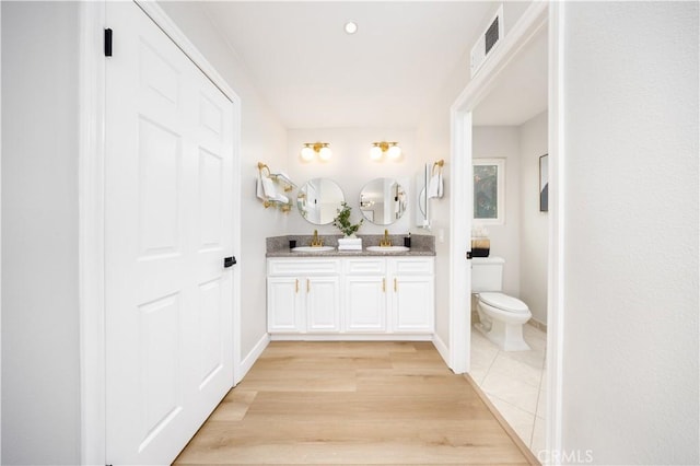 621 Foxhaven Pl, Diamond Bar, CA 91765 - bathroom with double vanity, toilet, and baseboards