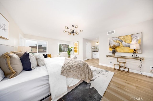 621 Foxhaven Pl, Diamond Bar, CA 91765 - bedroom with a chandelier, light wood finished floors, baseboards, and connected bathroom