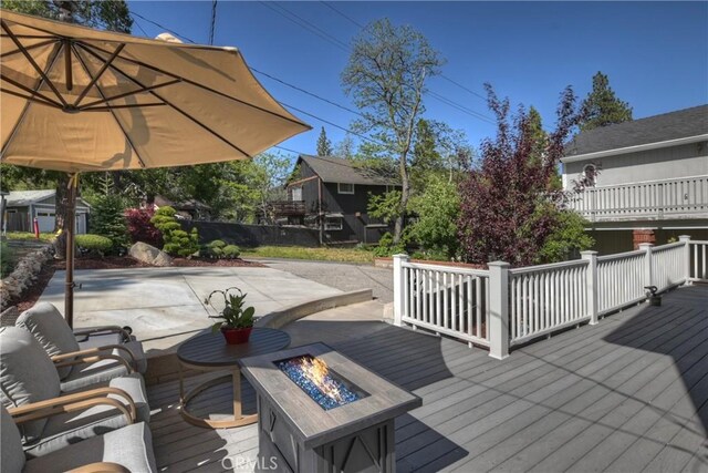 22771 Fir Ln, Crestline, CA 92325 - deck with an outdoor fire pit and a patio