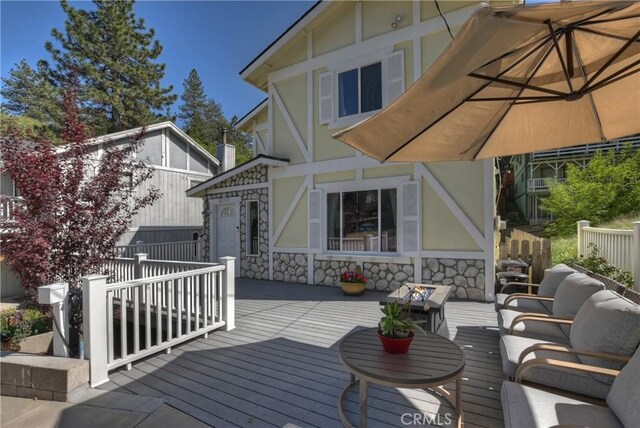 22771 Fir Ln, Crestline, CA 92325 - wooden terrace with outdoor lounge area and a garage