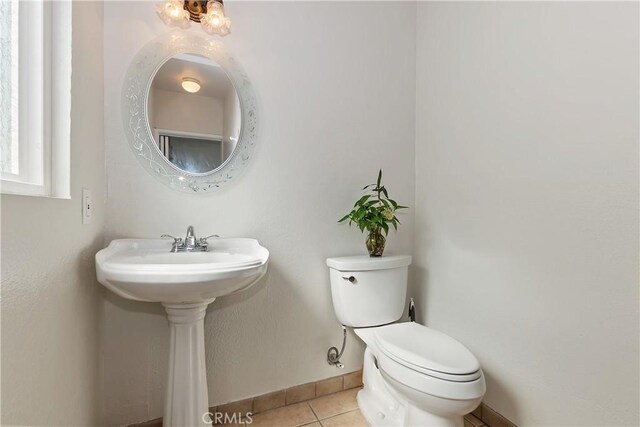 22771 Fir Ln, Crestline, CA 92325 - half bath with tile patterned floors, toilet, and baseboards