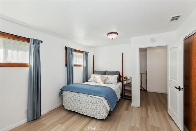 22771 Fir Ln, Crestline, CA 92325 - bedroom with light wood-type flooring and baseboards