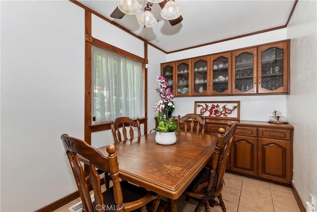 22771 Fir Ln, Crestline, CA 92325 - dining space with a chandelier, baseboards, light tile patterned floors, and ornamental molding