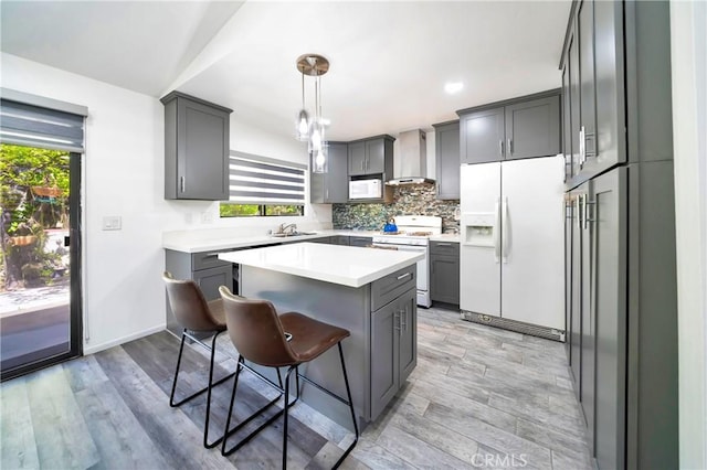 7035 Jon Allan Dr, North Hollywood, CA 91605 - kitchen featuring white appliances, wall chimney exhaust hood, a sink, gray cabinetry, and recessed lighting