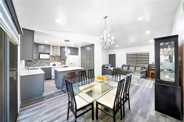 7035 Jon Allan Dr, North Hollywood, CA 91605 - dining space with a chandelier, light wood finished floors, and recessed lighting