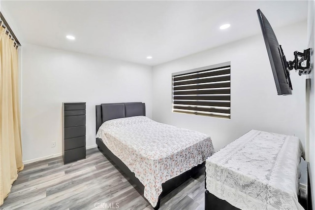 7035 Jon Allan Dr, North Hollywood, CA 91605 - bedroom with wood finished floors, recessed lighting, and baseboards