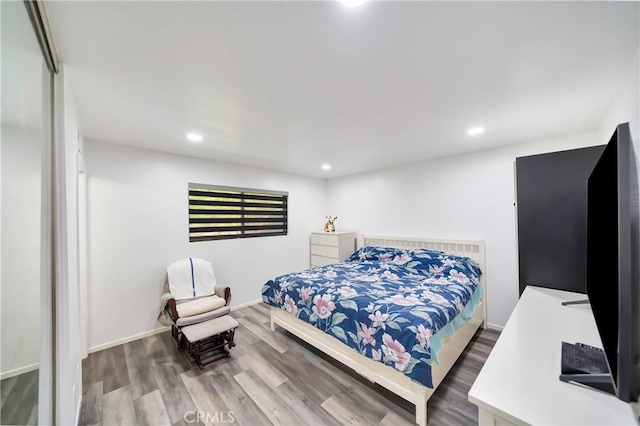 7035 Jon Allan Dr, North Hollywood, CA 91605 - bedroom featuring wood finished floors, recessed lighting, and baseboards