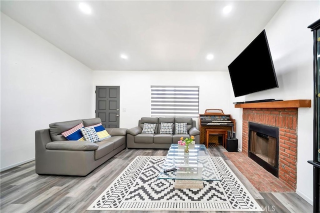 7035 Jon Allan Dr, North Hollywood, CA 91605 - living area with wood finished floors, a brick fireplace, and recessed lighting