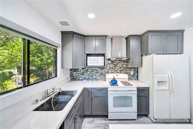 7035 Jon Allan Dr, North Hollywood, CA 91605 - kitchen with white appliances, wall chimney range hood, a sink, gray cabinetry, and recessed lighting