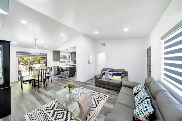 7035 Jon Allan Dr, North Hollywood, CA 91605 - living room featuring vaulted ceiling, a chandelier, light wood-type flooring, and recessed lighting