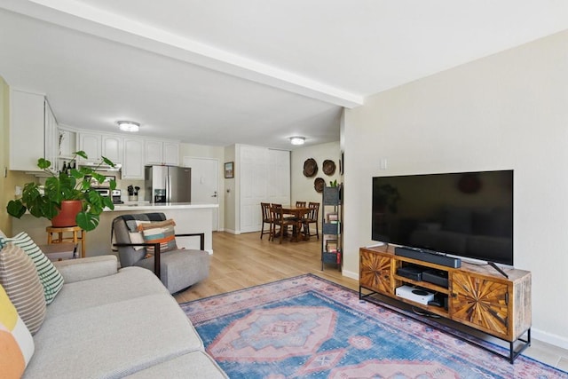 3505 Angelucci St Unit 1N, San Diego, CA 92111 - living room with light wood-style floors, baseboards, and beamed ceiling