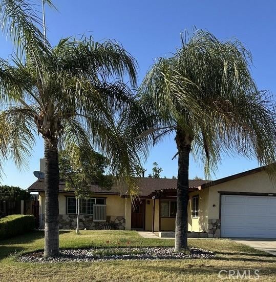2378 Thisa Way, Hemet, CA 92544 - ranch-style house with stone siding, stucco siding, a garage, a front lawn, and concrete driveway