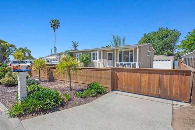 1529 Moreno St, Oceanside, CA 92054 - view of front of home with a fenced front yard and a detached garage