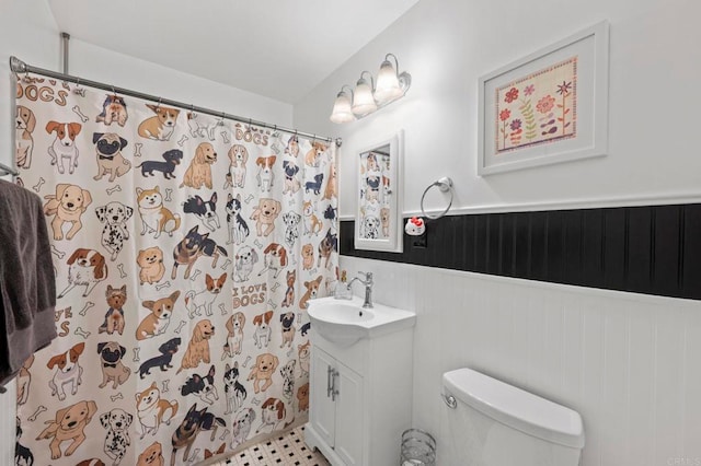 1529 Moreno St, Oceanside, CA 92054 - full bathroom featuring vanity, toilet, a wainscoted wall, and curtained shower