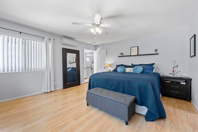 1529 Moreno St, Oceanside, CA 92054 - bedroom with an AC wall unit, wood finished floors, baseboards, and ceiling fan