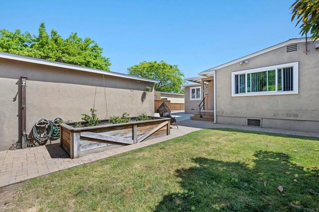 1529 Moreno St, Oceanside, CA 92054 - view of grassy yard featuring entry steps, a patio, and a garden