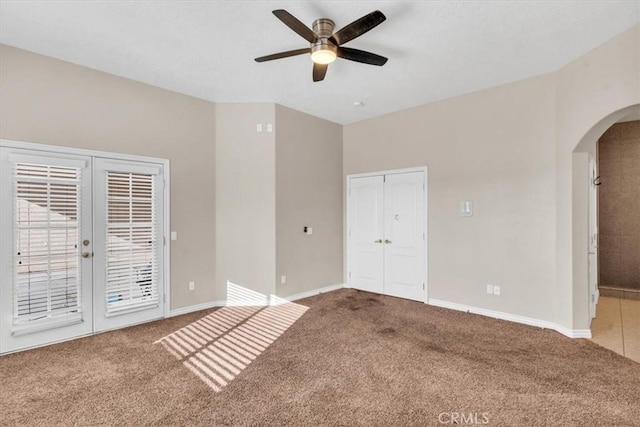 17322 Danbury Ave, Hesperia, CA 92345 - unfurnished bedroom featuring arched walkways, access to outside, carpet flooring, french doors, and a ceiling fan