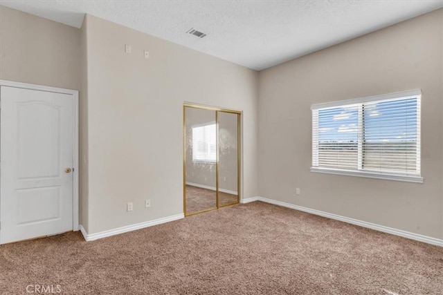 17322 Danbury Ave, Hesperia, CA 92345 - unfurnished bedroom featuring carpet floors, a closet, and a textured ceiling