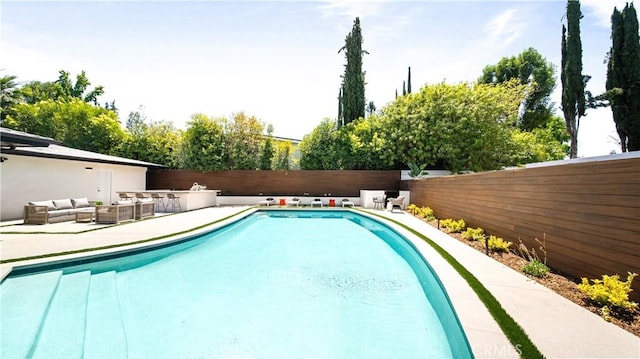 18823 La Amistad Pl, Tarzana, CA 91356 - view of swimming pool featuring a fenced backyard, an outdoor living space, and a patio area