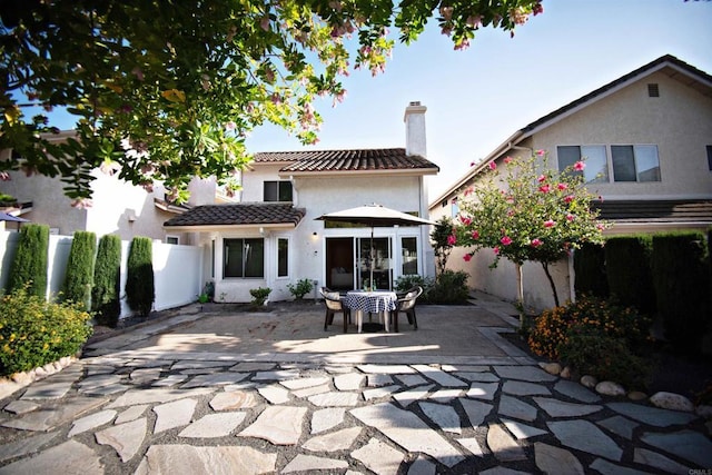 10908 Avenida Playa Veracruz, San Diego, CA 92124 - back of property with a chimney, a patio, stucco siding, and a tile roof