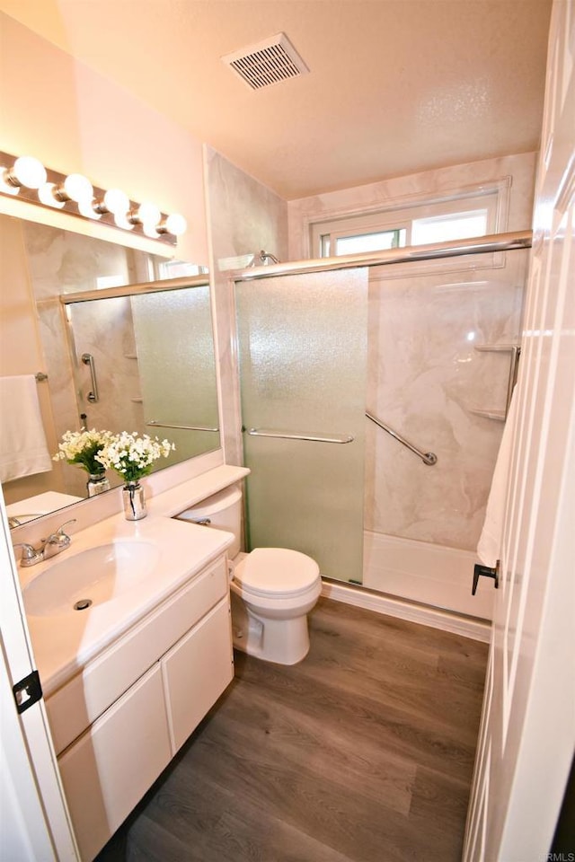 10908 Avenida Playa Veracruz, San Diego, CA 92124 - full bath featuring wood finished floors, vanity, a stall shower, and toilet