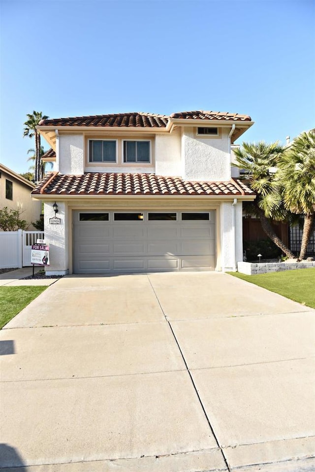 10908 Avenida Playa Veracruz, San Diego, CA 92124 - view of front of home featuring a tile roof, concrete driveway, an attached garage, and stucco siding