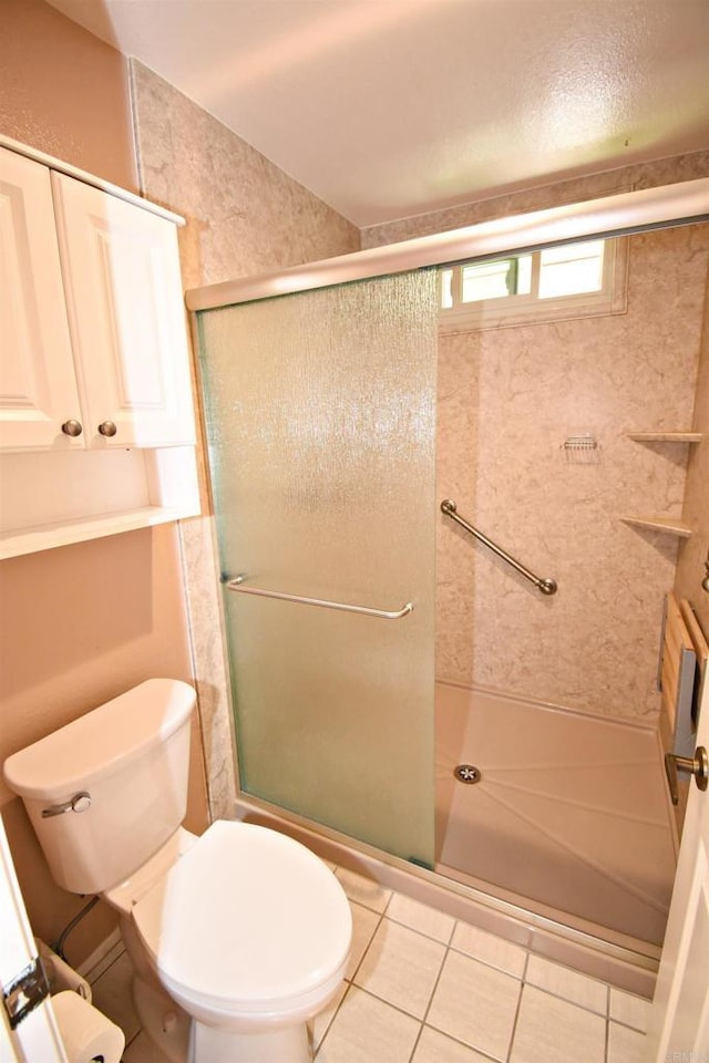 10908 Avenida Playa Veracruz, San Diego, CA 92124 - bathroom with a shower stall, toilet, and tile patterned floors