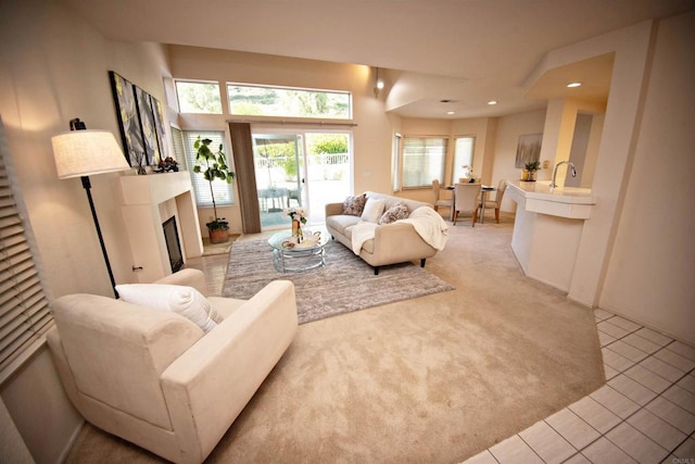 10908 Avenida Playa Veracruz, San Diego, CA 92124 - living room with light colored carpet, a fireplace, and recessed lighting